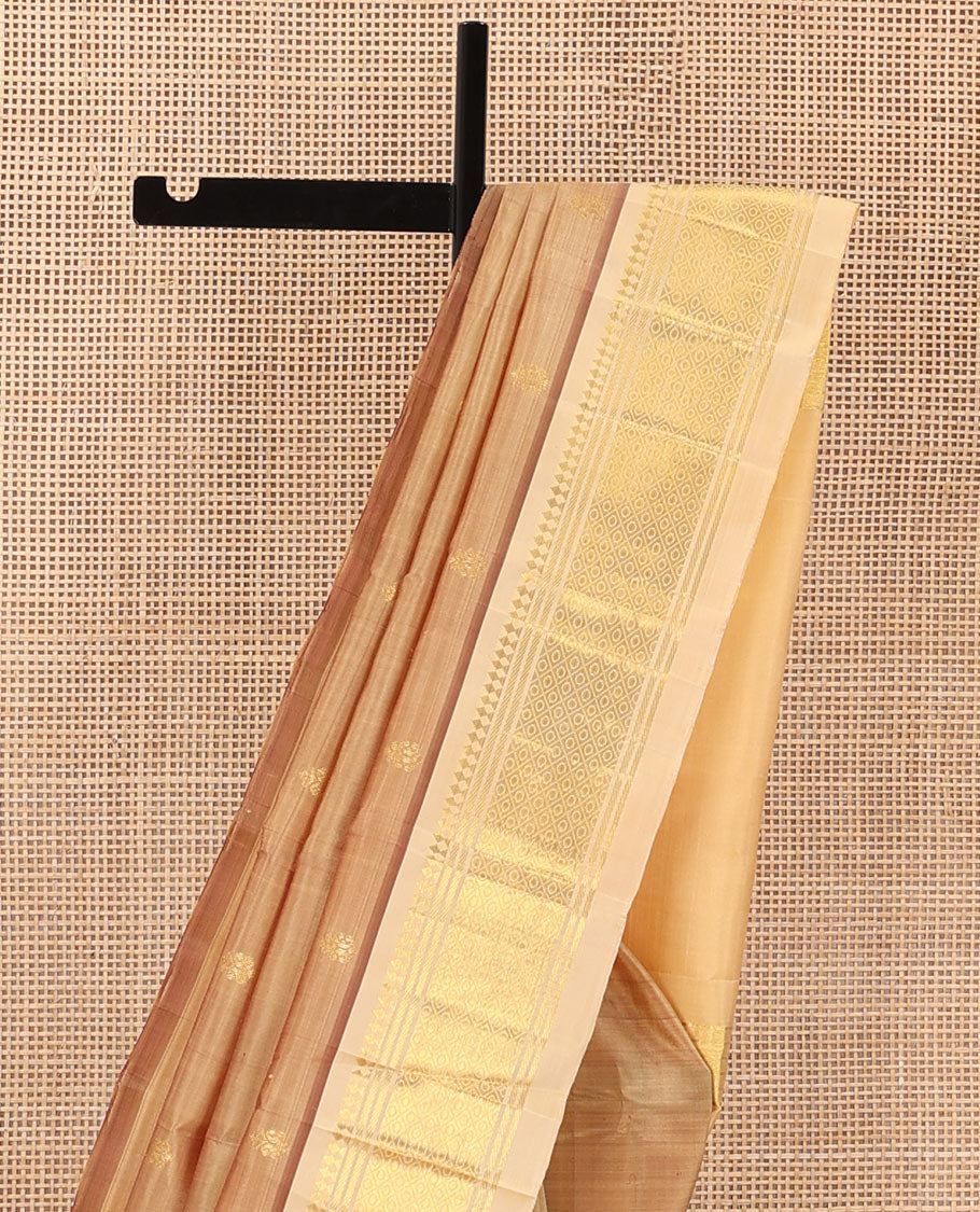 Sandal zari buttas Kanchipuram silk saree, contrast one-sided border of panner sombu, banaras, and mayil kann, and zari woven pallu