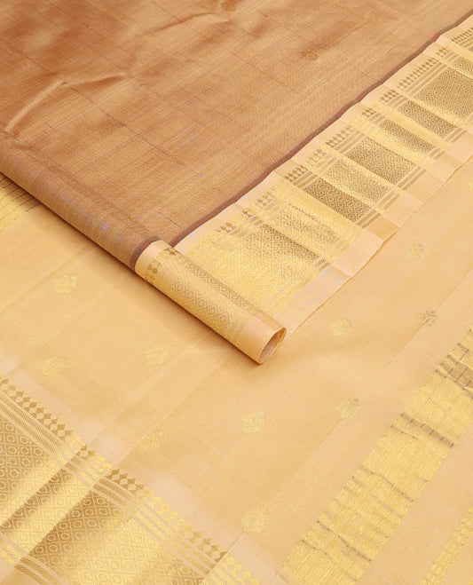 Sandal zari buttas Kanchipuram silk saree, contrast one-sided border of panner sombu, banaras, and mayil kann, and zari woven pallu