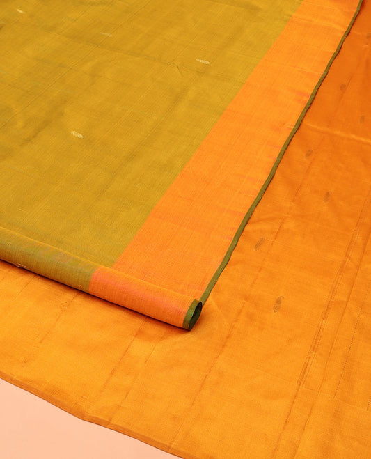 Green Kanchipuram Silk Saree, Sparsely Woven with Buttas All Over Its Body, Complemented by a Contrast Border of Thilakam Designs, Pallu Features Manga Zari Designs, and Paired with a Contrast Blouse