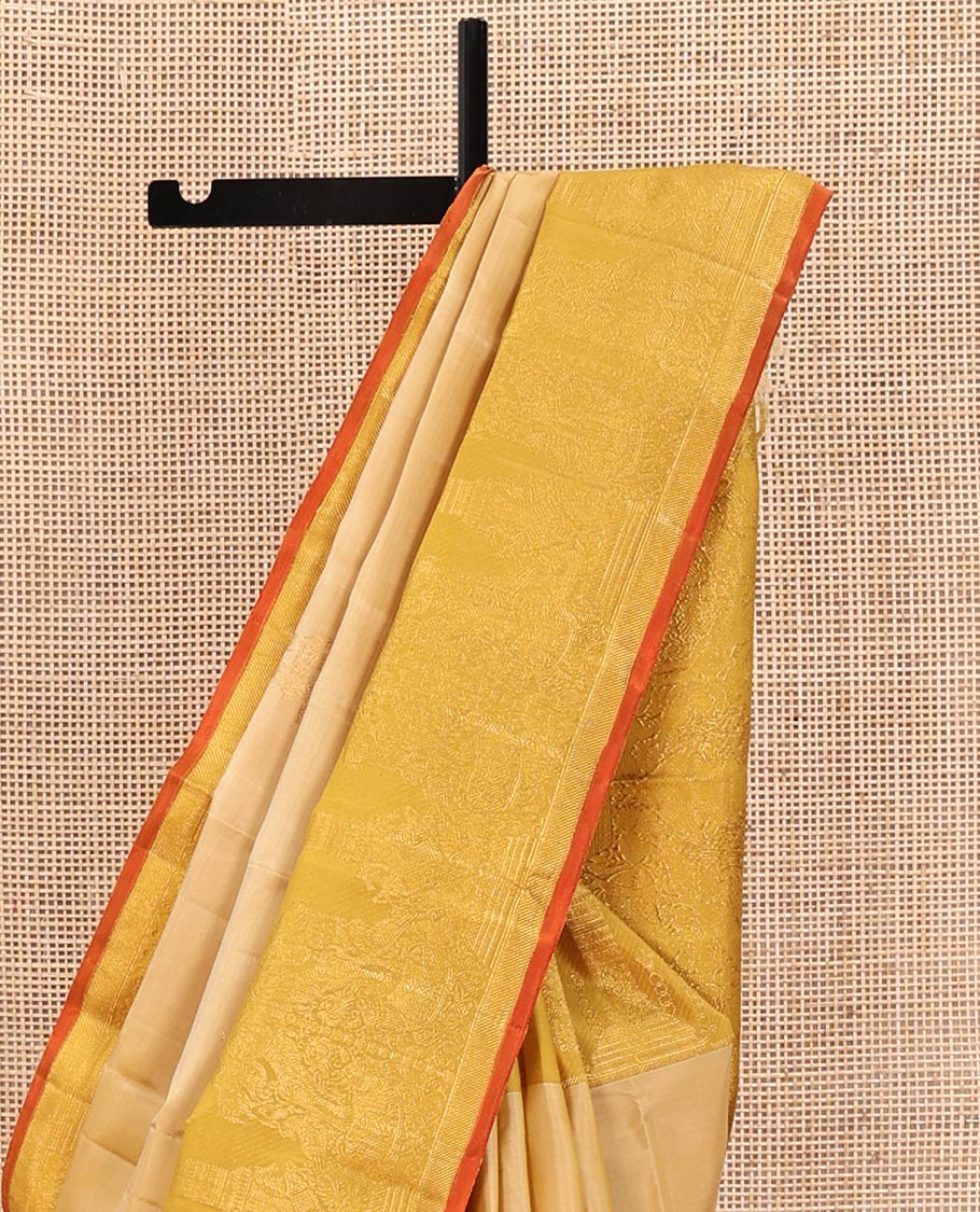 Sandal Kanchipuram Designer Silk Saree, Gracefully Embellished with Buttas All Over Its Body, Complemented by a Contrast Border of Mayil, Kuthirai, Yaali, and Pichwai Cow Designs, Grandly Woven Jaal Pallu, and Paired with a Contrast Blouse