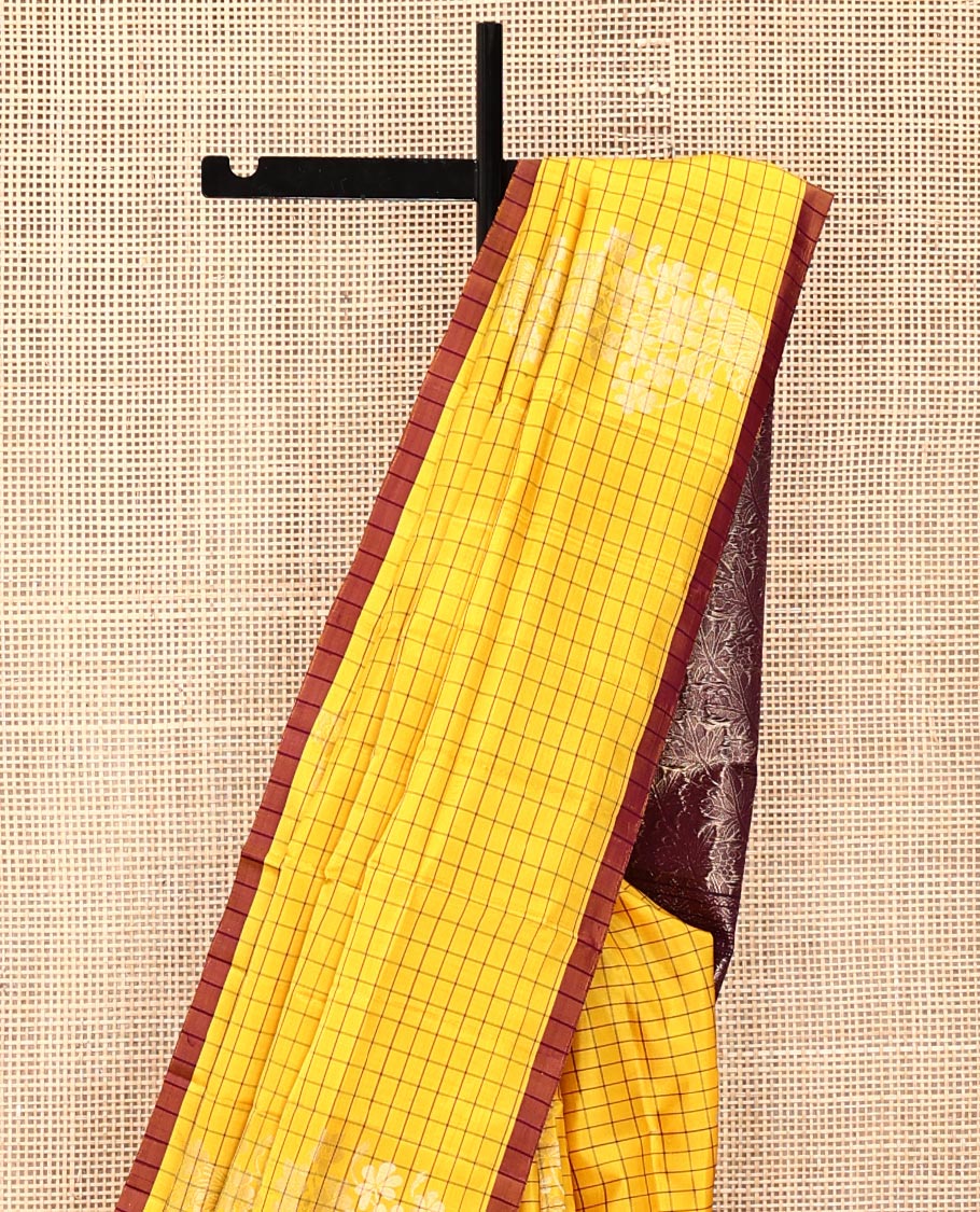 Yellow Mayuri Soft Silk Saree, Richly Detailed with Checks and Buttas All Over Its Body, Subtle Contrast Piping Border, Majestically Detailed Pallu of Leaf Designs, and Paired with a Contrast Blouse