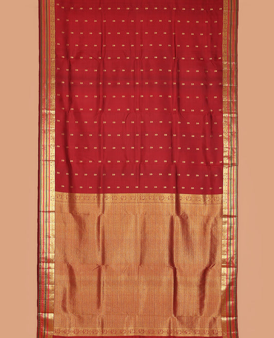 Maroon zari buttas nine-yard silksaree,zari border of rekku,mayil chakram,mayil kann,banaras & neli & intricate pallu