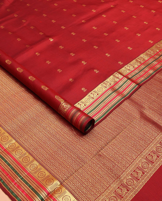 Maroon zari buttas nine-yard silksaree,zari border of rekku,mayil chakram,mayil kann,banaras & neli & intricate pallu