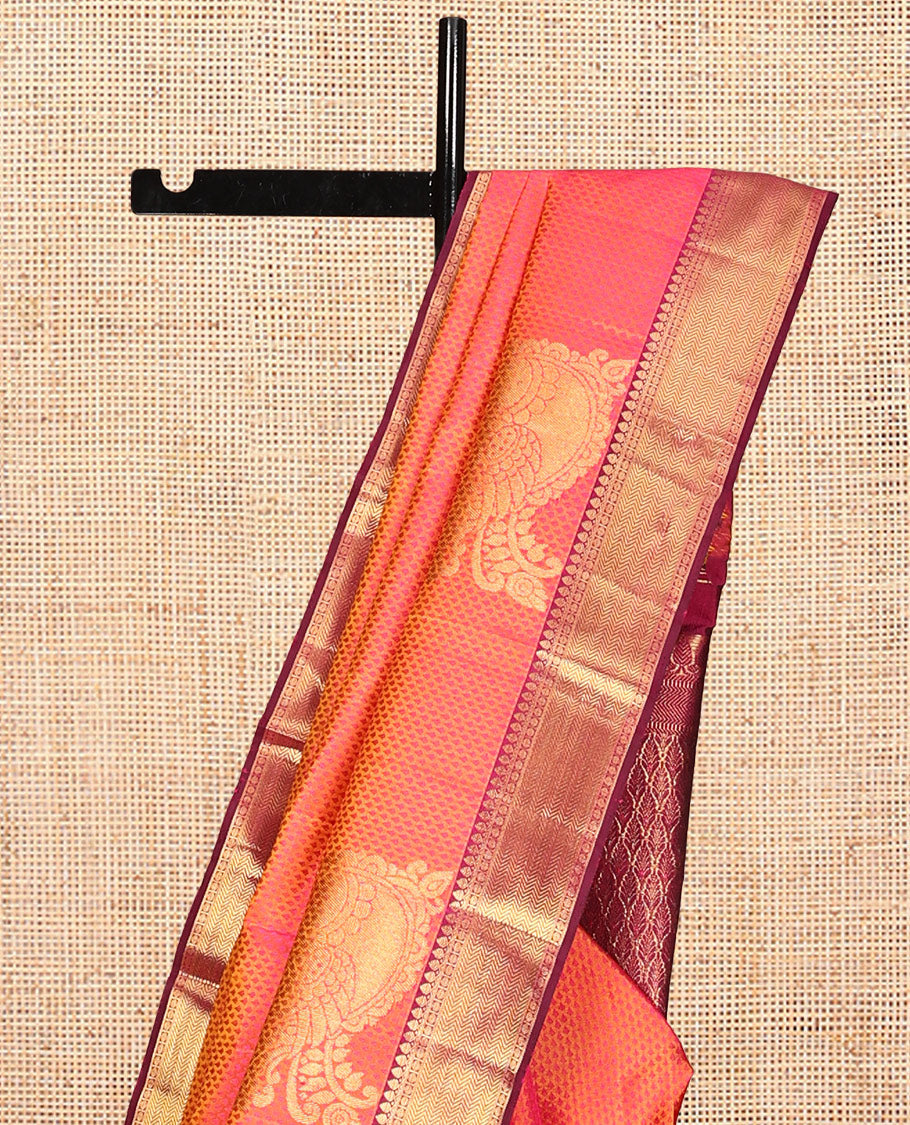 Orange Embossed Parambara Silk Saree, Adorned with Mayil Buttas, a Contrast Border of Thilakam Mokku, Poun, and Vanki Designs, Grand Pallu, and Contrast Blouse