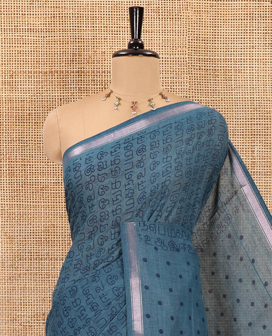 Blue tamil letters printed soft cotton saree, zari piping border, small polka dotted pallu, and blouse of abstract and polka dots print