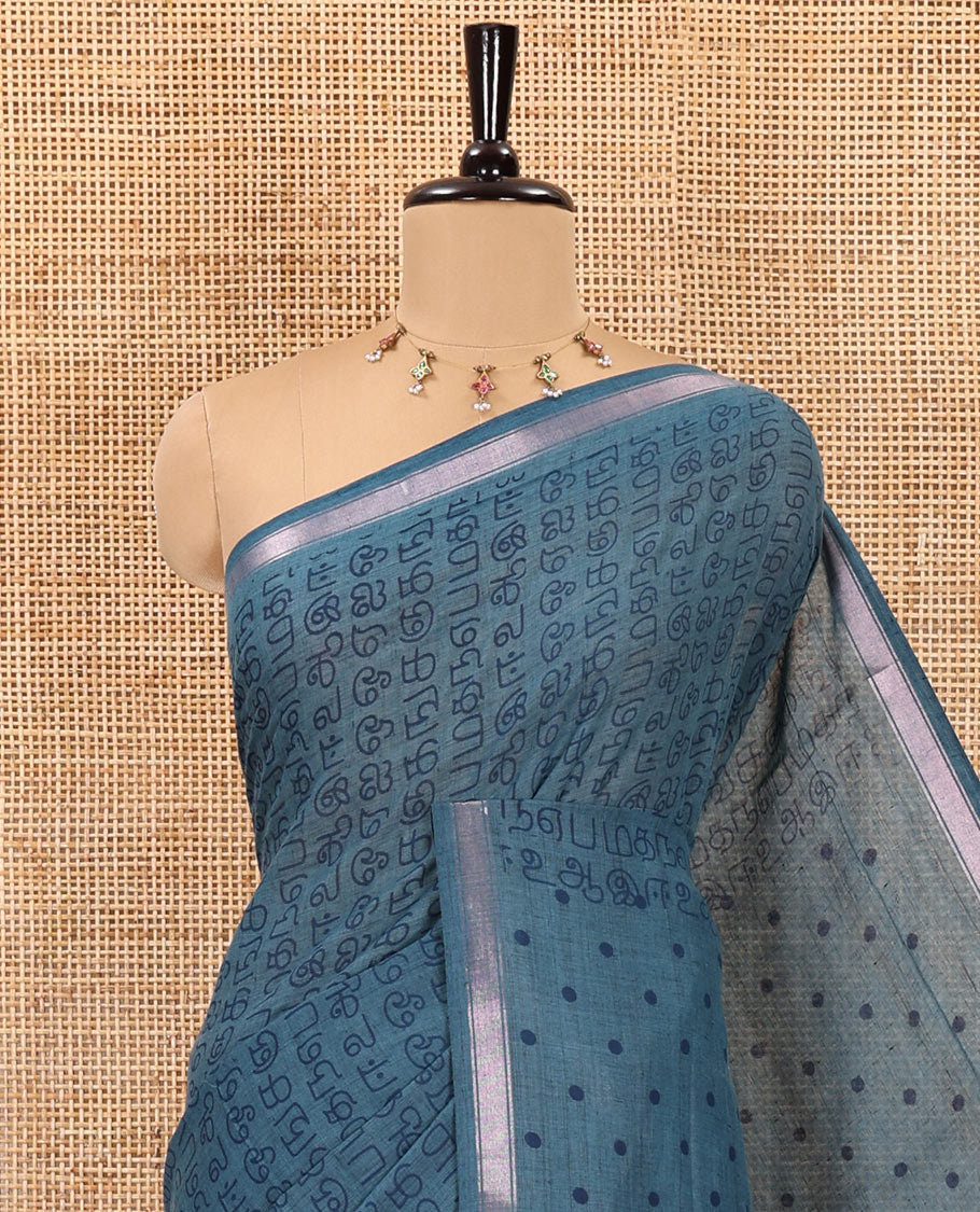 Blue tamil letters printed soft cotton saree, zari piping border, small polka dotted pallu, and blouse of abstract and polka dots print