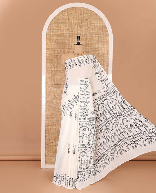 Cream warli-style human motifs block printed mul cotton saree, warli block printed border, warli block printed pallu, and a matching blouse
