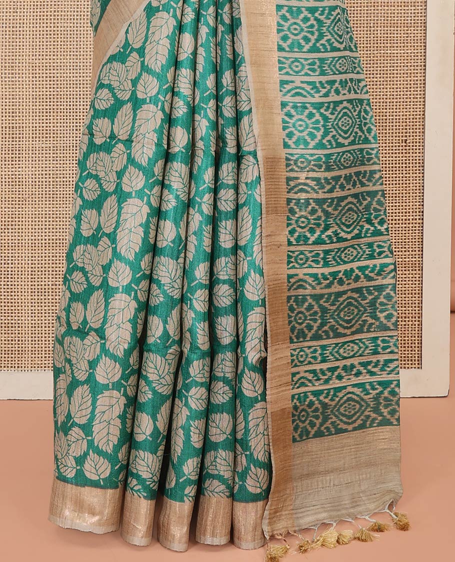 Green Tussar Silk Saree Accentuated with Leaf Motifs Printed All Over Its Body, Featuring a Contrast Border, Complemented by Contrast Pallu of Ikkat-Style Print, and Paired with a Matching Blouse