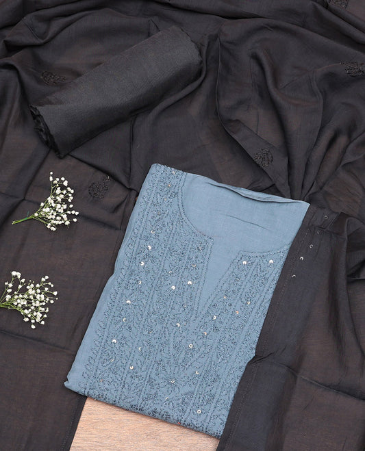 Grey Cotton Material Churidar Set, Subtly Crafted with Sequined Thread Neck Work Top, a Contrast Plain Bottom, and Thread Dupatta