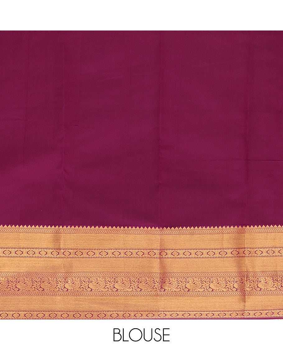 Brown Vasundhara Lite Silk Mix Saree Showcasing Zig-Zag Stripes Across the Body, Enhanced by a Contrast Border Adorned with Rekku, Puli Nagam, Laddu Kamalam, and Mayil Motifs, Complemented with a Zari-Woven Pallu and a Contrast Blouse