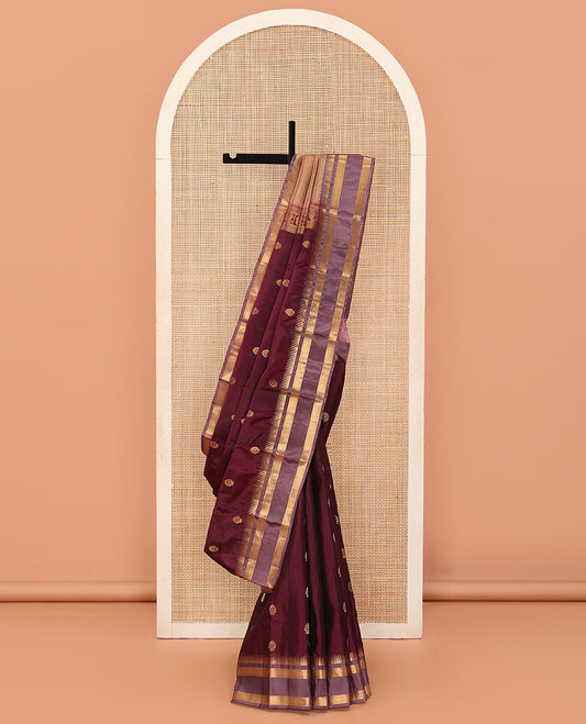 Maroon Vasundhara Lite Silk Mix Saree Bedecked with Zari Buttas, Featuring a Contrast Varisai Pettu Border of Rekku, Muthu, and Ara Maadam Designs, Pallu Elevated with Vanki Designs, and a Contrast Blouse