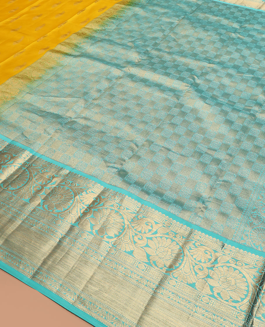 Yellow zari buttas silk saree, contrast border of thilakam, poun, kodi visiry, mayil kann, neli, and kathir designs, and butta enclosed checked pallu