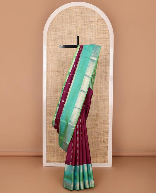Purple meena buttas silksaree, contrast rettai pettu border of thilakam mokku,banaras,muthu & kodi visiry & zari-rich gleaming motifs pallu