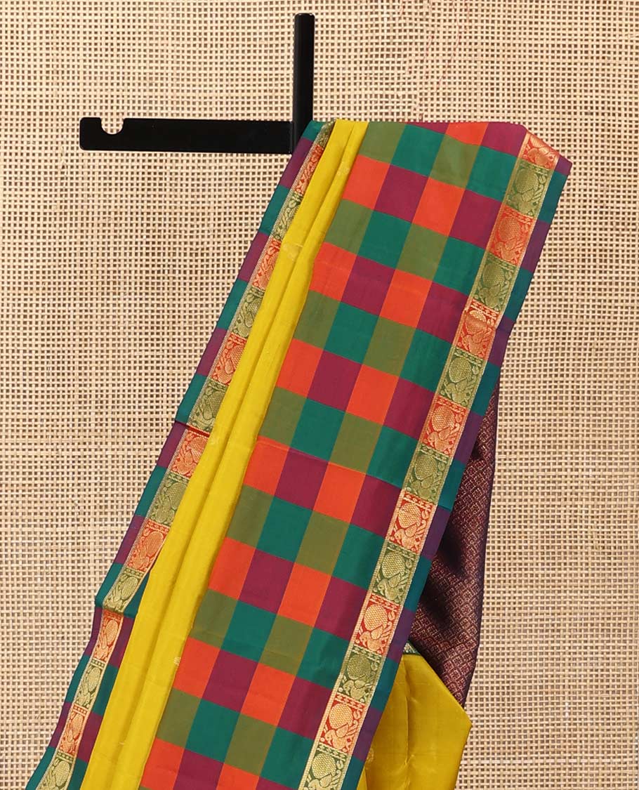 Yellow zari buttas Kanchipuram silk saree, contrast multi-color checked border of jadai nagam, and mayil designs, and contrast zari-rich jaal pallu