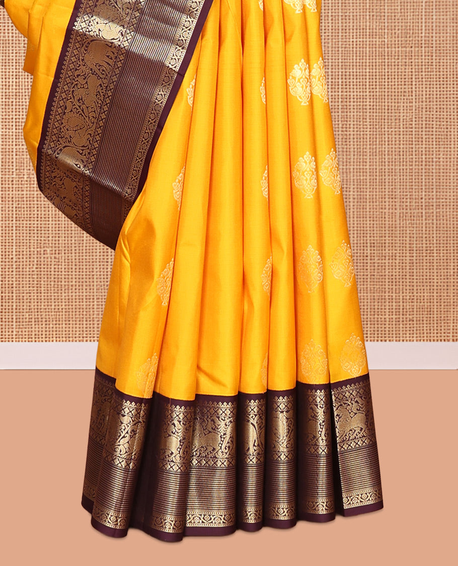 Yellow Vasundhara Silk Saree, Richly Detailed with Zari Buttas, Contrast Border of Thilakam Mokku, Mayil Kann, Yaali, Yaanai, Mayil, and Kodi Visiry, Grand Pallu, and a Contrast Blouse