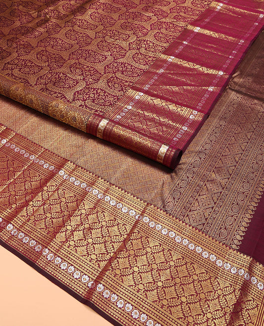 Maroon jacquard kanchipuram silk saree, zari border of thilakam mokku, kodi visiry,  and jaal designs, and jaal pallu