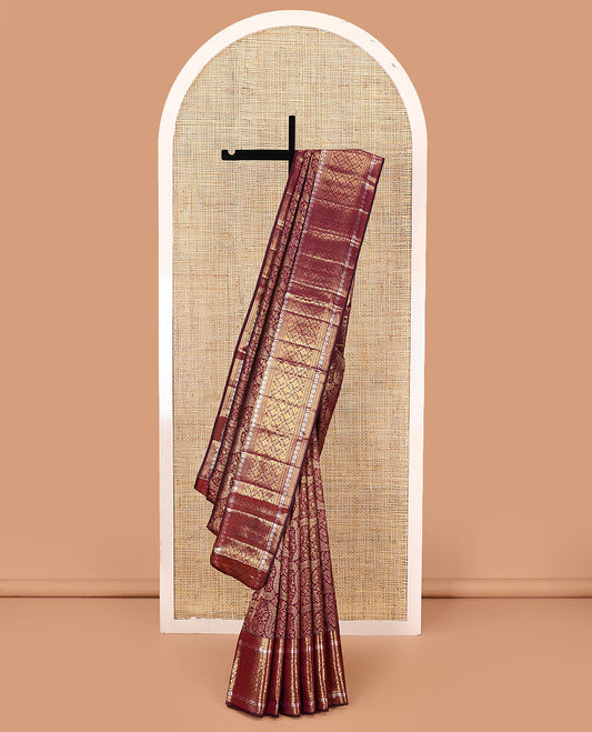 Maroon jacquard kanchipuram silk saree, zari border of thilakam mokku, kodi visiry,  and jaal designs, and jaal pallu