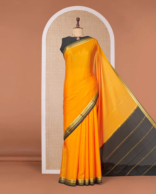 Orange Plain Mysore Silk Saree, Complemented by a Contrast Traditional Zari Design Border, Zari Striped Pallu, and Paired with a Contrast Blouse