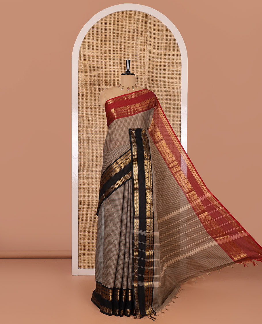 Beige Checked Chettinad Cotton Saree, Adorned with Contrast Ganga Jamuna Rettai Pettu Peacock Chakram Border, Subtly Zari Striped Pallu, and a Matching Blouse