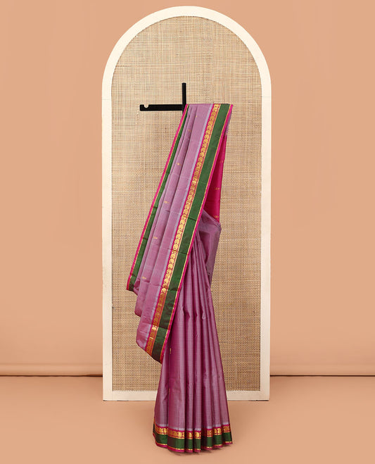 Purple striped and buttas Kanchipuram silk saree, contrast rettai pettu border of manga and kathir designs, and zari design pallu