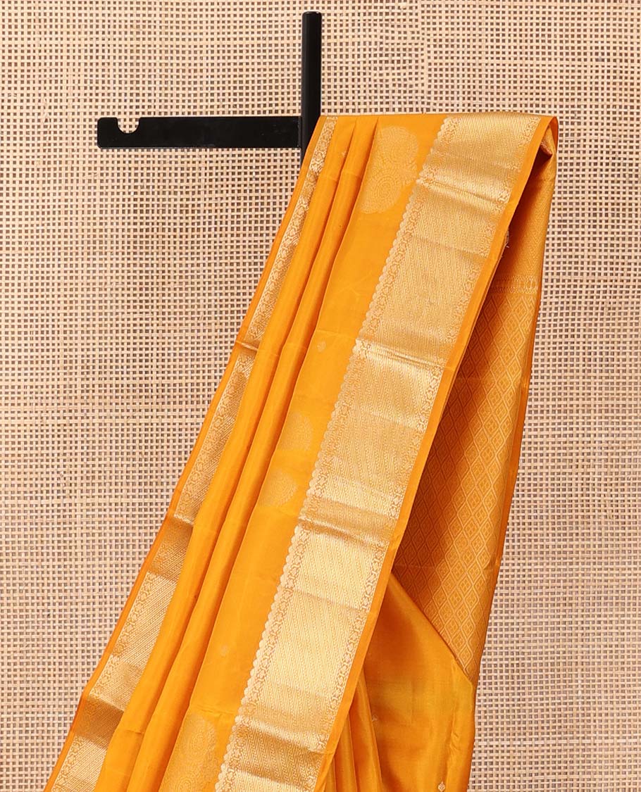 Yellow zari buttas silk saree, traditional zari border and zari-rich jaal pallu
