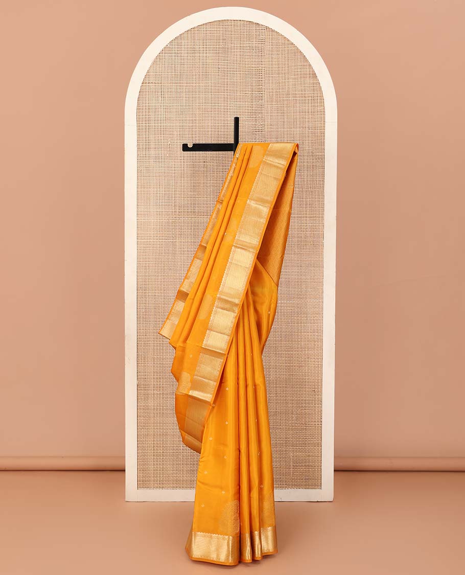 Yellow zari buttas silk saree, traditional zari border and zari-rich jaal pallu