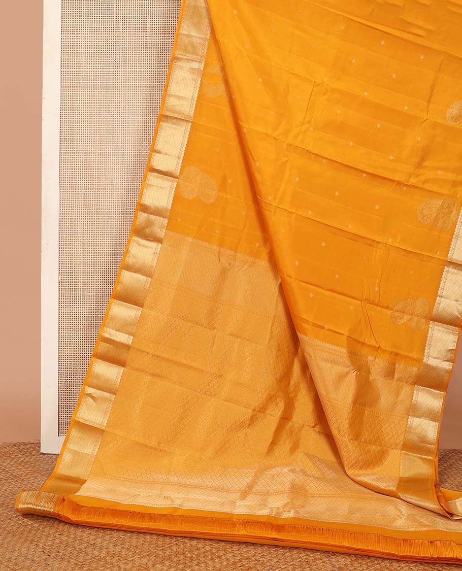 Yellow zari buttas silk saree, traditional zari border and zari-rich jaal pallu