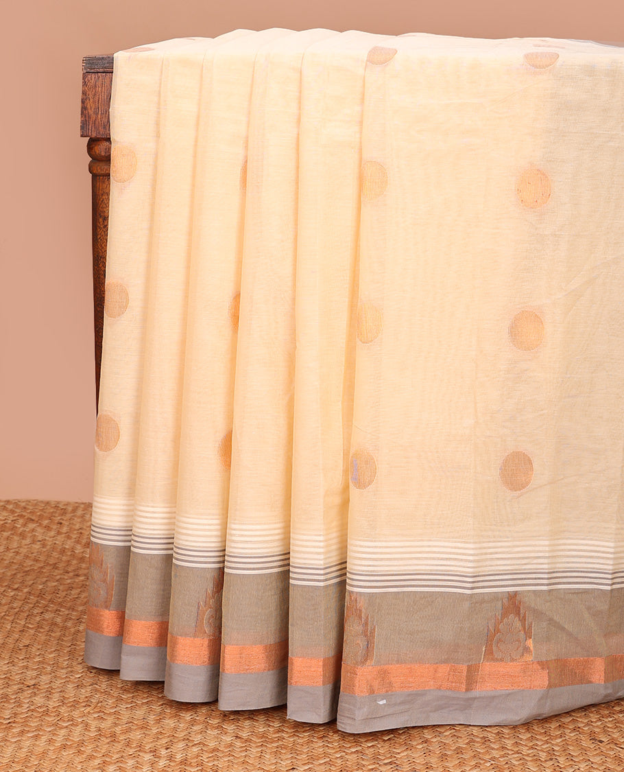 Cream polka dots buttas kanchi cotton saree, contrast zari motifs border, and pallu of jaal designs