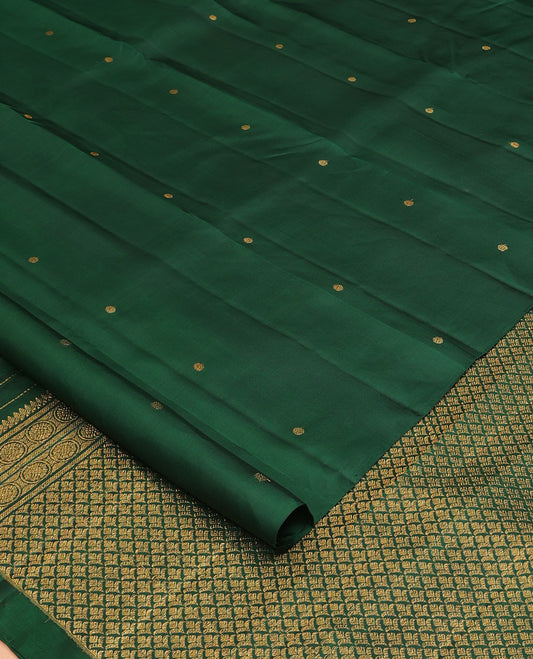 Borderless green zari buttas Kanchipuram silk saree, self-pallu of thilakam mokku, banaras, chakram, and jaal designs