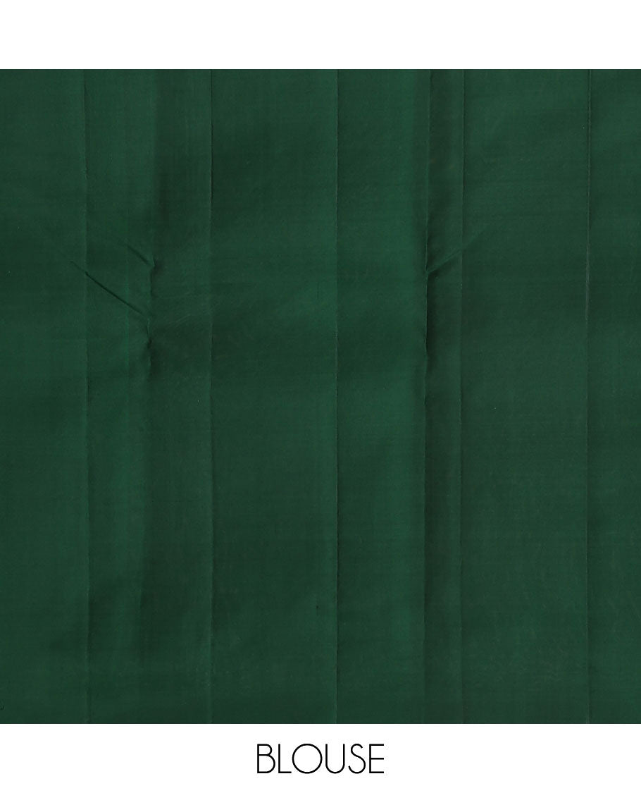 Borderless green zari buttas Kanchipuram silk saree, self-pallu of thilakam mokku, banaras, chakram, and jaal designs