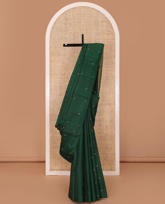 Borderless green zari buttas Kanchipuram silk saree, self-pallu of thilakam mokku, banaras, chakram, and jaal designs