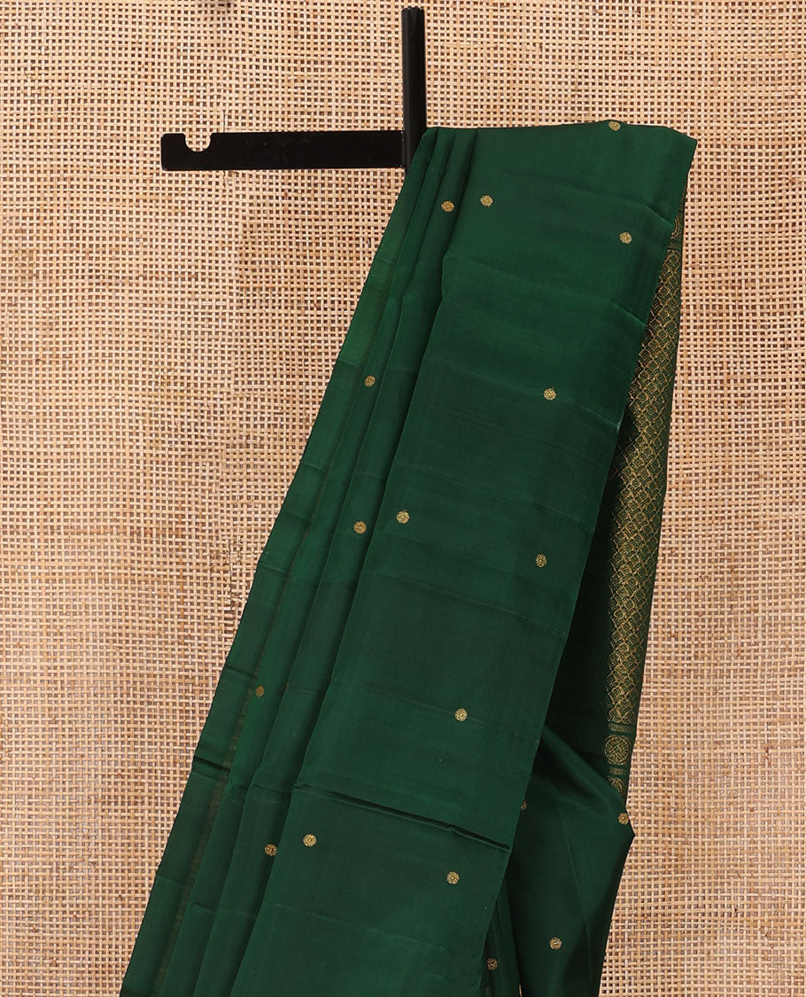 Borderless green zari buttas Kanchipuram silk saree, self-pallu of thilakam mokku, banaras, chakram, and jaal designs