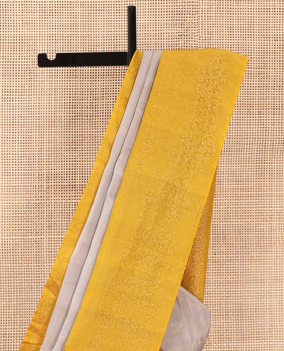 Grey buttas soft silk saree, contrast floral jaal border, and pallu of floral jaal designs