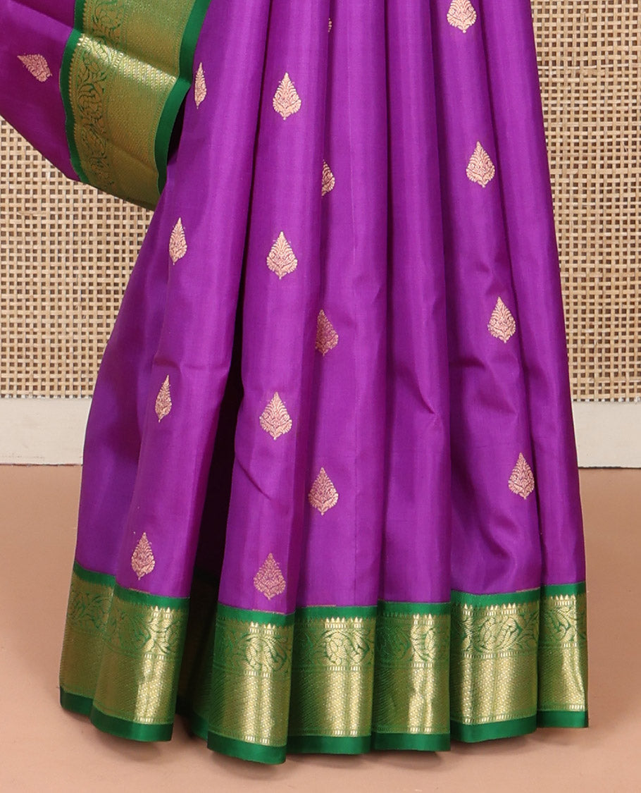 Purple Vasundhara Silk Saree, Ornamented with Zari Buttas All Over Its Body, Complemented by a Contrast Border of Rekku, Muthu, and Kodi Visiry Designs, Grand Pallu Steeped with Manga Designs, and Paired with a Contrast Blouse