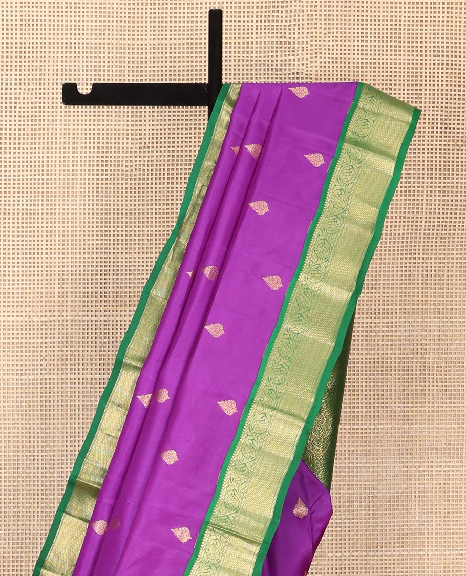 Purple Vasundhara Silk Saree, Ornamented with Zari Buttas All Over Its Body, Complemented by a Contrast Border of Rekku, Muthu, and Kodi Visiry Designs, Grand Pallu Steeped with Manga Designs, and Paired with a Contrast Blouse