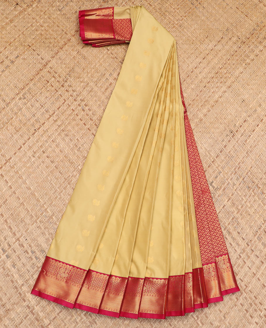 Yellow zari buttas budget silk saree, contrast traditional zari border, and pallu of jaal design