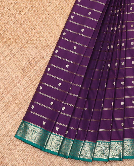 Violet Budget Silk Saree Detailed with Zari Stripes and Peacock Buttas, Complemented by a Contrast Border of Traditional Zari Designs, Subtly Jaal Design Pallu, and Paired with a Contrast Blouse