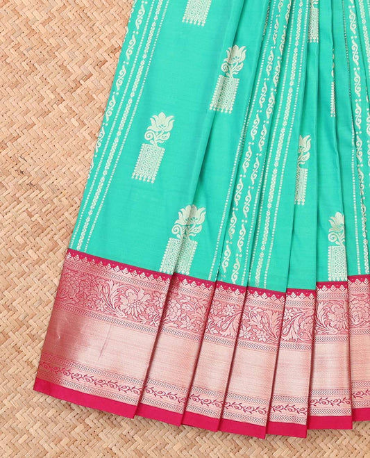 Turquoise buttas and striped budget silk saree, contrast traditional zari design border, and pallu of floral and paisleys