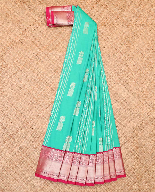 Turquoise buttas and striped budget silk saree, contrast traditional zari design border, and pallu of floral and paisleys