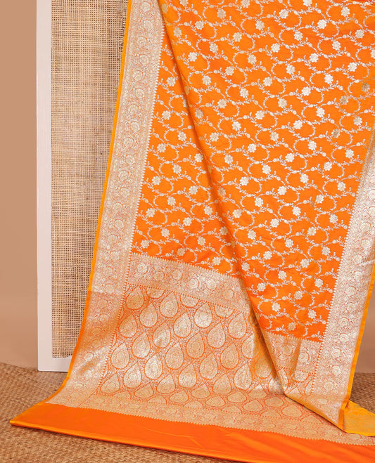 Orange floral jacquard semi banarasi satin, floral creeper zari border & pallu of intricate designs