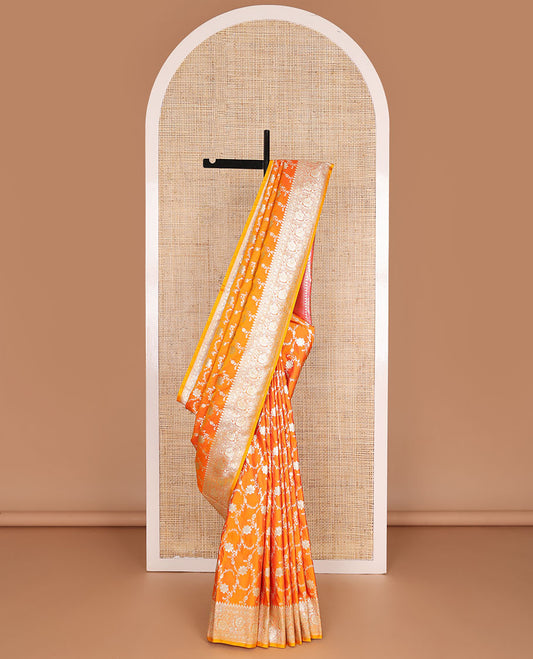 Orange floral jacquard semi banarasi satin, floral creeper zari border & pallu of intricate designs