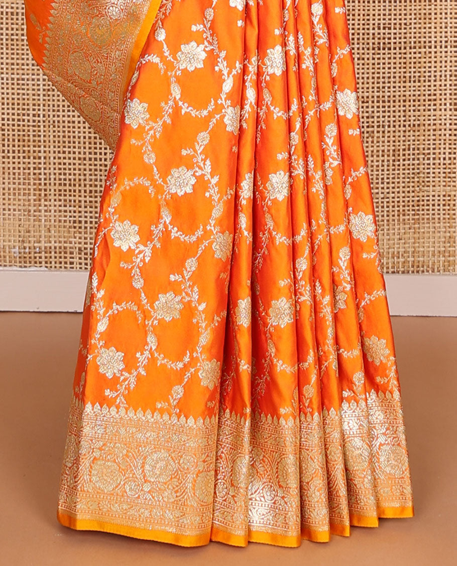 Orange floral jacquard semi banarasi satin, floral creeper zari border & pallu of intricate designs