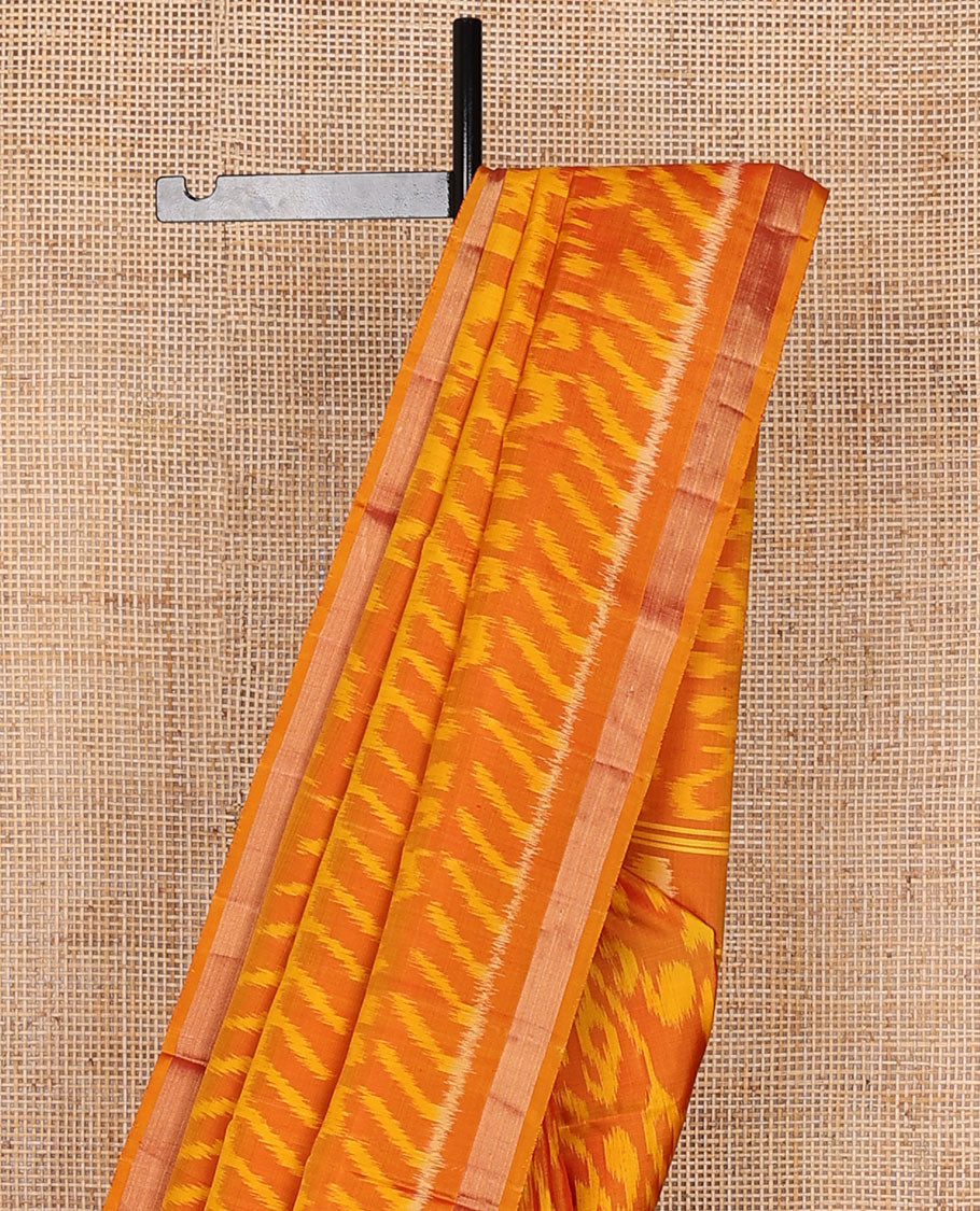 Orange intricately ikkat design woven pure ikkat saree, zari border & pallu of ikkat designs