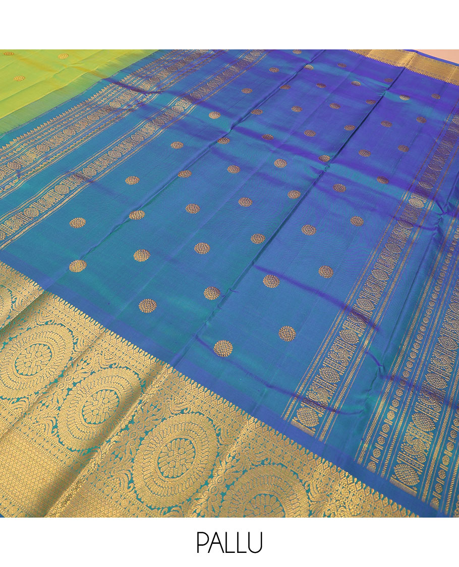 Green chakram buttas Kanchipuram silk saree, contrast border of muthu, rudraksham,  poo chakram, and mayil kann designs, and chakram motifs pallu