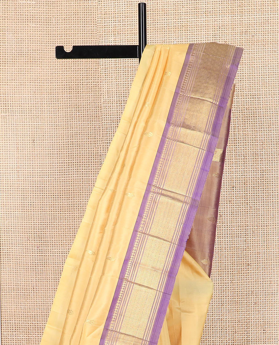 Sandal zari buttas Kanchipuram silk saree, contrast one-sided border of paneer sombu, banaras, muthu and then kuli kann designs, and pallu of zari designs
