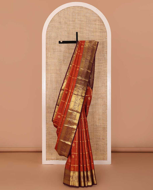 Orange zari buttas and checked Kanchipuram silk saree,contrast border of thilakam,banaras and mayil designs, and jaal pallu