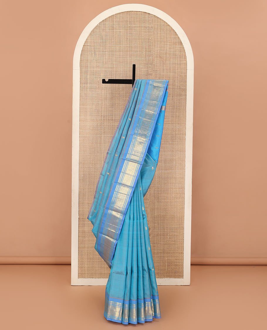 Blue zari buttas Kanchipuram silk saree, contrast one-sided border of panner sombu, muthu, banaras, and jaal, and zari woven pallu