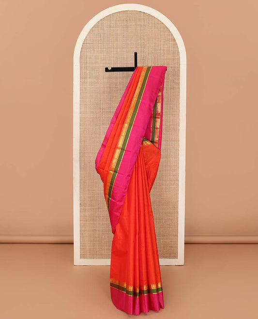Orange striped Kanchipuram silk saree, contrast kaal erangina rettai pettu border of diamond, vanki, and kathir designs, and zari design pallu