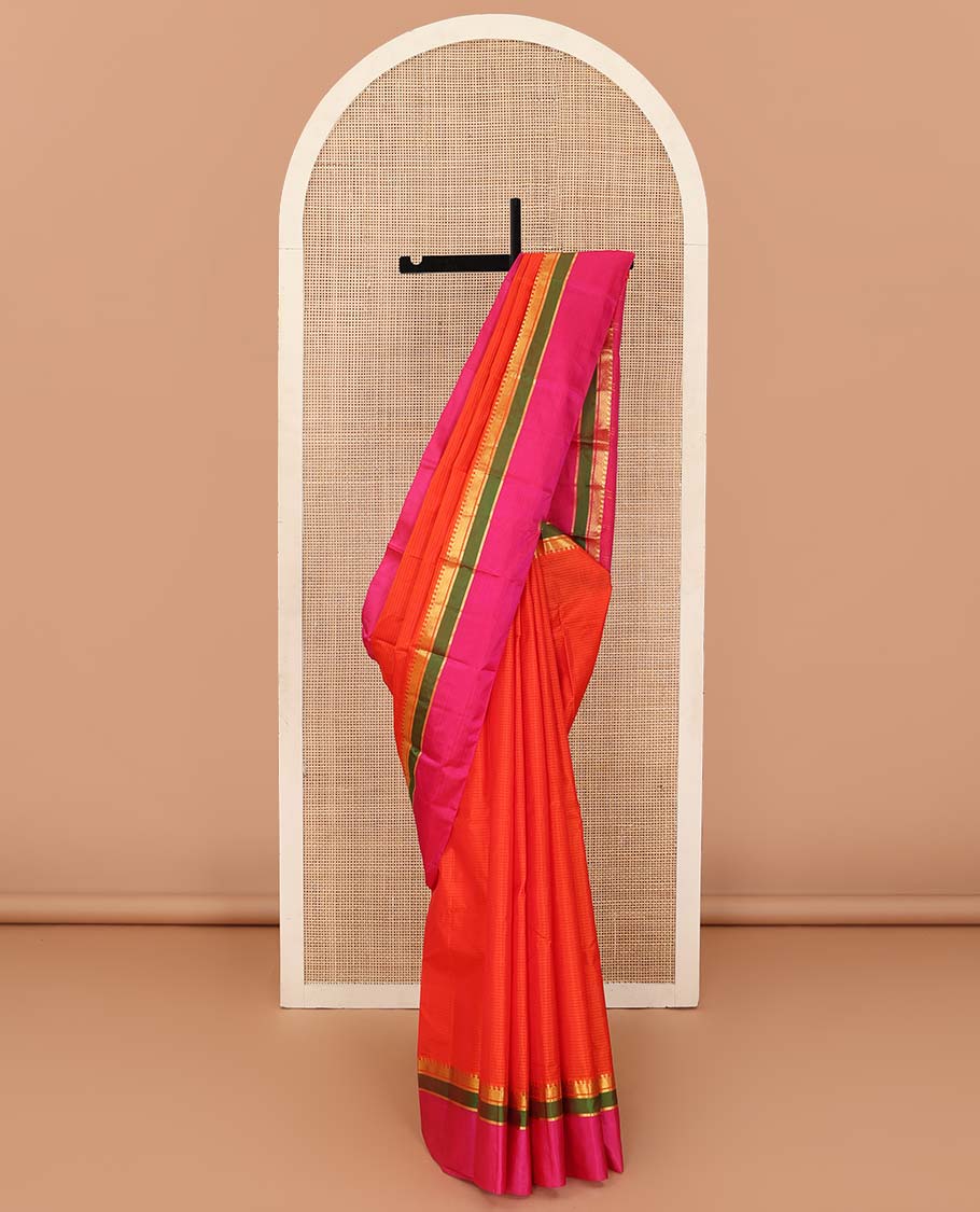 Orange striped Kanchipuram silk saree, contrast kaal erangina rettai pettu border of diamond, vanki, and kathir designs, and zari design pallu