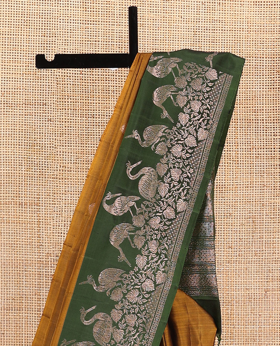 Green zari buttas soft silk saree, contrast floral and bird motifs border, and pallu of jaal, floral, and bird designs